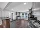 Modern kitchen with marble countertops, gray cabinets, and open concept design at 212 Lake Forest Dr, Acworth, GA 30102