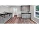 Kitchen featuring granite countertops, stainless steel sink and gray cabinets at 212 Lake Forest Dr, Acworth, GA 30102
