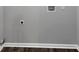 Laundry room with gray walls and wood flooring at 212 Lake Forest Dr, Acworth, GA 30102