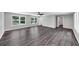 The open living space features light gray walls, dark wood laminate flooring and natural light at 212 Lake Forest Dr, Acworth, GA 30102
