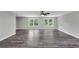 The open living space features light gray walls, dark wood laminate flooring and natural light at 212 Lake Forest Dr, Acworth, GA 30102