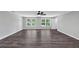 Open-concept living room with hard surface floors and a ceiling fan at 212 Lake Forest Dr, Acworth, GA 30102