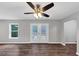 Bright living room with hardwood floors, ceiling fan, and glass patio doors at 212 Lake Forest Dr, Acworth, GA 30102