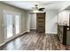 Living room area with doors to the deck and a view of the kitchen bar at 212 Lake Forest Dr, Acworth, GA 30102