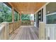 Covered porch with wood ceiling and railings offering a warm welcome to the home at 212 Lake Forest Dr, Acworth, GA 30102