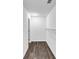 A walk-in closet offers ample storage space with dark wood laminate flooring and metal shelving at 212 Lake Forest Dr, Acworth, GA 30102