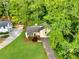 Aerial view highlighting the home's lush surroundings, driveway, and well-maintained lawn at 2929 Alberta Dr, Marietta, GA 30062