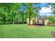Expansive backyard with deck, lush lawn, mature trees offering privacy at 2929 Alberta Dr, Marietta, GA 30062