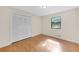 Bright bedroom with hardwood floors, closet, and window offering natural light at 2929 Alberta Dr, Marietta, GA 30062