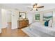 The bright bedroom features hardwood floors, a ceiling fan and nice decor at 2929 Alberta Dr, Marietta, GA 30062
