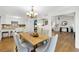 Bright dining room that is open to the kitchen and living spaces boasts hardwood floors and modern decor at 2929 Alberta Dr, Marietta, GA 30062