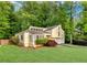 Charming home with a lush green lawn and mature trees providing ample shade and privacy at 2929 Alberta Dr, Marietta, GA 30062