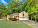 Inviting two-story home featuring a well-manicured lawn, two-car garage, and lush landscaping at 2929 Alberta Dr, Marietta, GA 30062