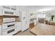 White kitchen features stainless appliances with breakfast bar and is open to the dining room at 2929 Alberta Dr, Marietta, GA 30062