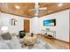Cozy living room with wood ceiling, recessed lights, modern furnishings, and mounted TV at 2929 Alberta Dr, Marietta, GA 30062