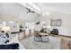 Open-concept living room with wood floors, vaulted ceilings, and an abundance of natural light at 2929 Alberta Dr, Marietta, GA 30062