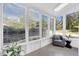 Bright sunroom with many windows and an armchair, perfect for enjoying nature views at 2929 Alberta Dr, Marietta, GA 30062