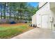 View of a spacious backyard, partialy fenced, with an air conditioning unit alongside the house at 4100 Howell Park Rd, Duluth, GA 30096