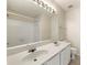 A spacious bathroom features a double sink vanity, large mirror, and a shower-tub combo at 4100 Howell Park Rd, Duluth, GA 30096