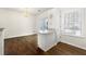 Dining room includes a breakfast bar, hardwood floors, and a sliding door for outdoor access at 4100 Howell Park Rd, Duluth, GA 30096