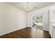 Dining area features hardwood flooring, modern chandelier, and sliding glass doors to the backyard at 4100 Howell Park Rd, Duluth, GA 30096