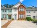 Charming townhome with colorful exteriors, decorative shutters, and well-maintained landscaping at 4100 Howell Park Rd, Duluth, GA 30096