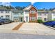 Charming townhome with a combination of brick and siding exterior and individual driveways at 4100 Howell Park Rd, Duluth, GA 30096