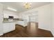Well-lit kitchen featuring granite countertops, stainless steel appliances, and hardwood flooring at 4100 Howell Park Rd, Duluth, GA 30096