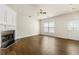 Inviting living room showcases a fireplace, hardwood floors, and natural light through large windows at 4100 Howell Park Rd, Duluth, GA 30096
