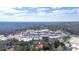 Aerial shot of home near retail area surrounded by trees, offering both convenience and a peaceful retreat from commercial area at 4806 Forest Trl, Douglasville, GA 30135