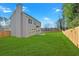 Expansive backyard featuring a patio, sliding glass doors and a privacy fence at 4806 Forest Trl, Douglasville, GA 30135