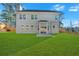 Expansive backyard featuring a patio, sliding glass doors and a privacy fence at 4806 Forest Trl, Douglasville, GA 30135