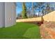 This spacious backyard has a lush lawn and a new wooden fence perfect for entertaining at 4806 Forest Trl, Douglasville, GA 30135