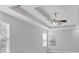Bedroom featuring a modern ceiling fan, large windows, and neutral-toned walls at 4806 Forest Trl, Douglasville, GA 30135
