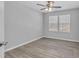 Bedroom featuring a ceiling fan and large windows that let in ample natural light at 4806 Forest Trl, Douglasville, GA 30135