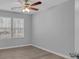 Bedroom featuring a ceiling fan and large windows that let in ample natural light at 4806 Forest Trl, Douglasville, GA 30135