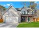Charming two-story home featuring a spacious two-car garage and a welcoming covered front porch at 4806 Forest Trl, Douglasville, GA 30135