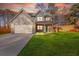 Charming two-story home featuring a spacious two-car garage and a welcoming covered front porch at 4806 Forest Trl, Douglasville, GA 30135