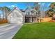 Charming two-story home featuring a spacious two-car garage and a welcoming covered front porch at 4806 Forest Trl, Douglasville, GA 30135