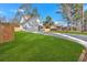Well-kept home featuring a long driveway and pristine, expansive front lawn at 4806 Forest Trl, Douglasville, GA 30135
