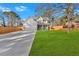 Two-story home with an expansive driveway, lush lawn, and a fenced backyard at 4806 Forest Trl, Douglasville, GA 30135