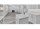 Open concept kitchen and living room with hardwood floors and a fireplace at 4806 Forest Trl, Douglasville, GA 30135