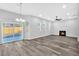 Bright living room with hardwood floors, a fireplace, and sliding glass doors to the backyard at 4806 Forest Trl, Douglasville, GA 30135