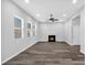 Bright living room showcasing hardwood floors, a fireplace, and ample natural light from the windows at 4806 Forest Trl, Douglasville, GA 30135