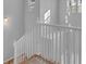 Bright staircase with white railing and natural light from windows at 4806 Forest Trl, Douglasville, GA 30135