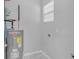 Utility room with water heater and connections for washing machine and dryer at 4806 Forest Trl, Douglasville, GA 30135