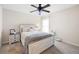 Cozy bedroom features a ceiling fan, plush carpet, and a comfortable bed with matching nightstands at 935 Mill Creek Ave, Canton, GA 30115