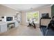 Sunlit bedroom featuring a vanity area, treadmill, and bike creating a functional and inviting space at 935 Mill Creek Ave, Canton, GA 30115