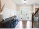 Bright foyer with hardwood floors, paneled walls, and a staircase with wrought iron spindles at 935 Mill Creek Ave, Canton, GA 30115