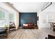 Stylish living room with a modern accent wall, hardwood floors, and ample seating at 935 Mill Creek Ave, Canton, GA 30115